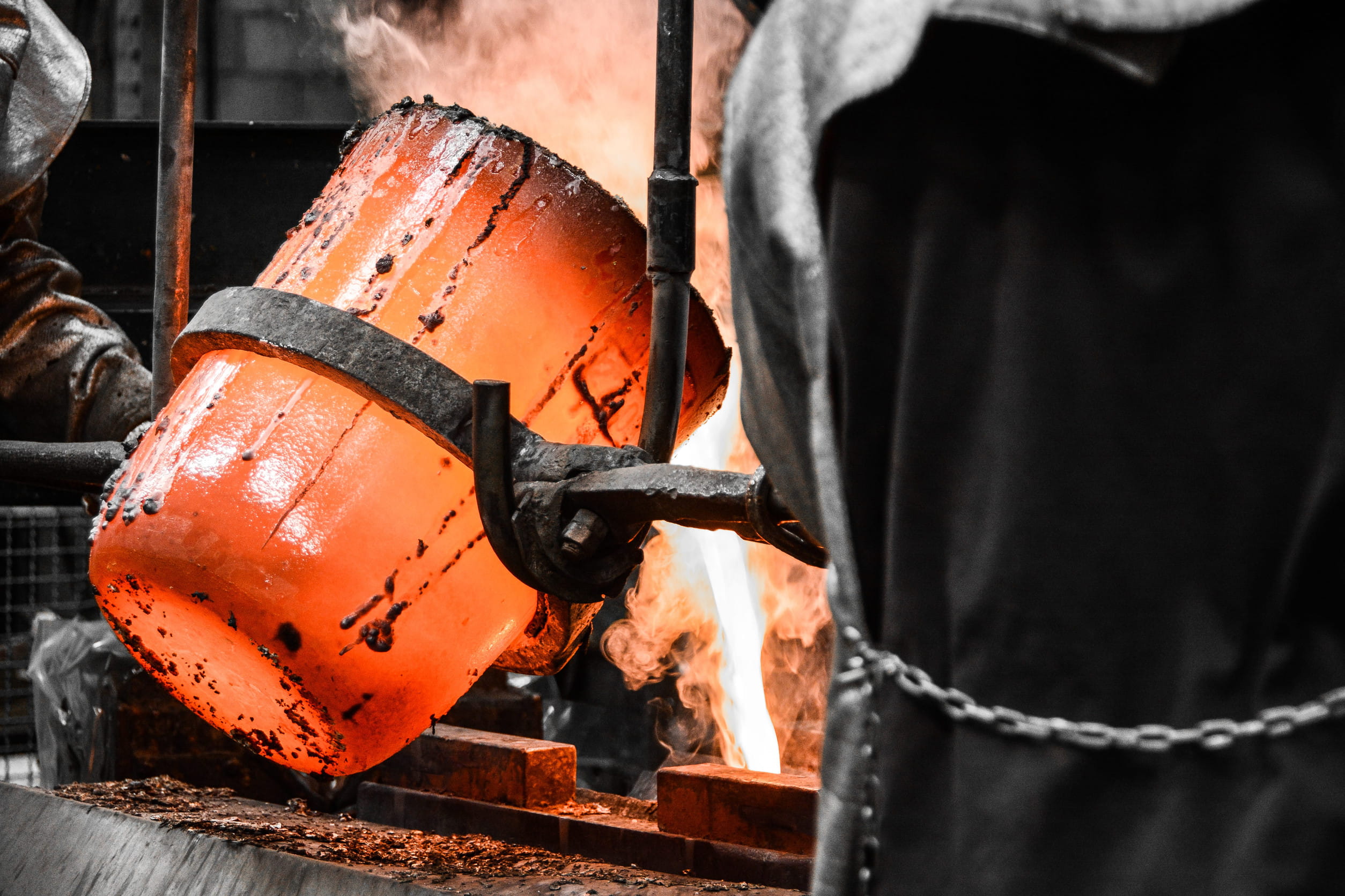 Artisan creating detailed bronze sculpture using traditional casting techniques