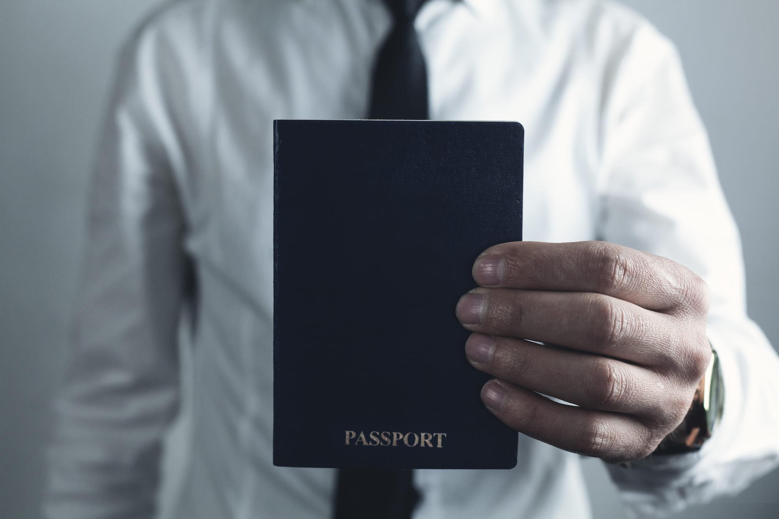 Businessman Holding Passport