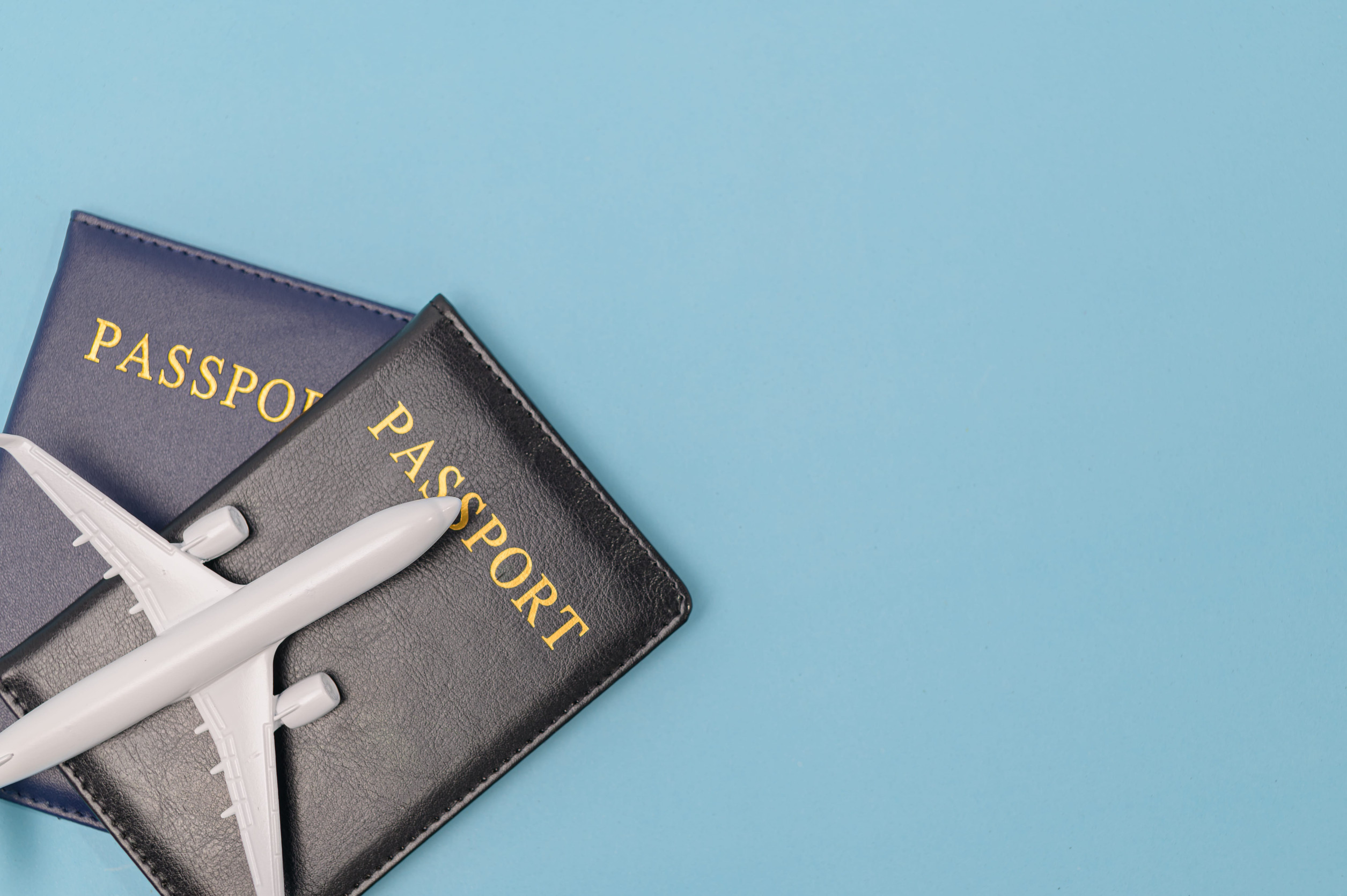 Passport And Airplane Travel Concept