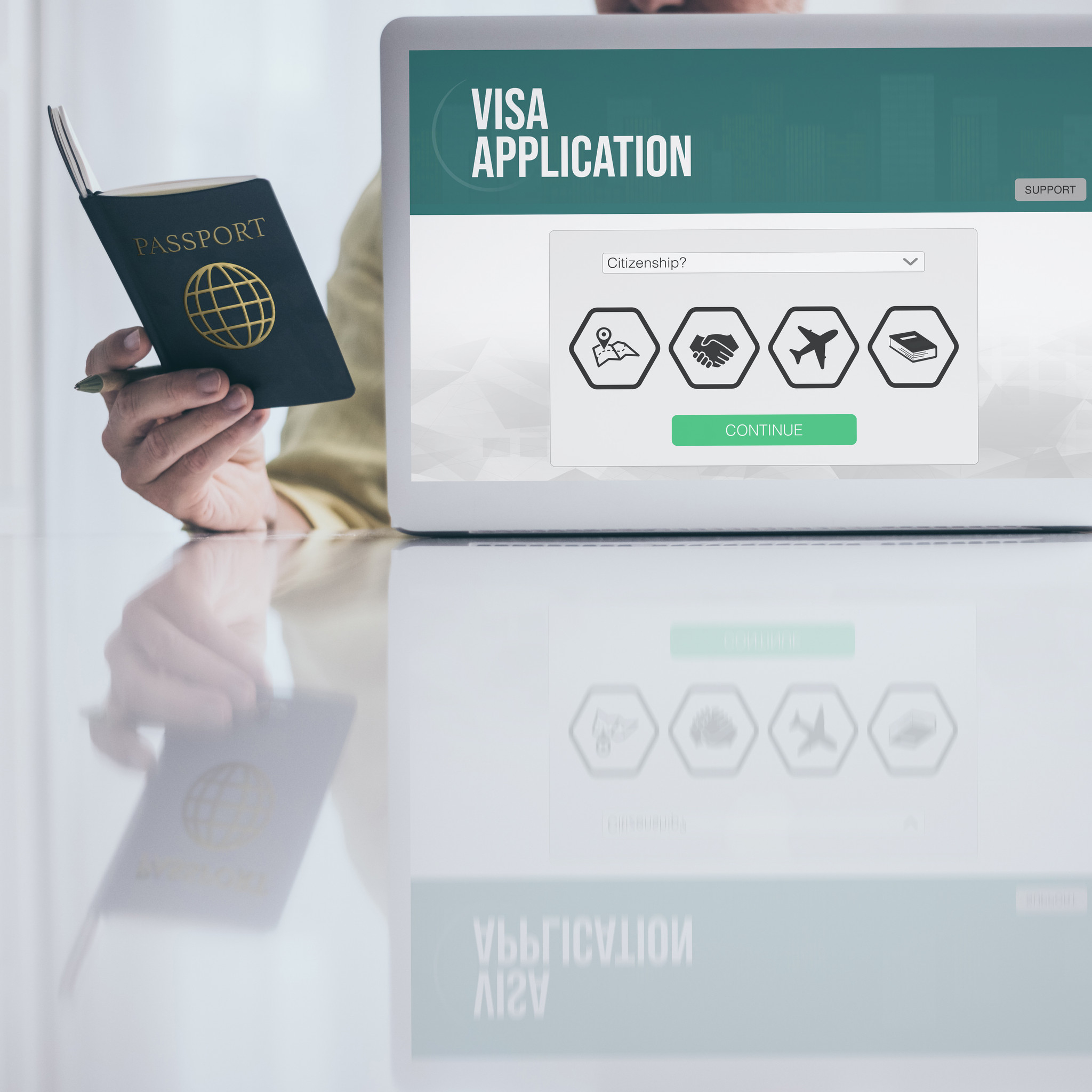 Man Holding Passport Filling Visa Application Form On Laptop Man Holding Passport Filling Visa Application Form On Laptop