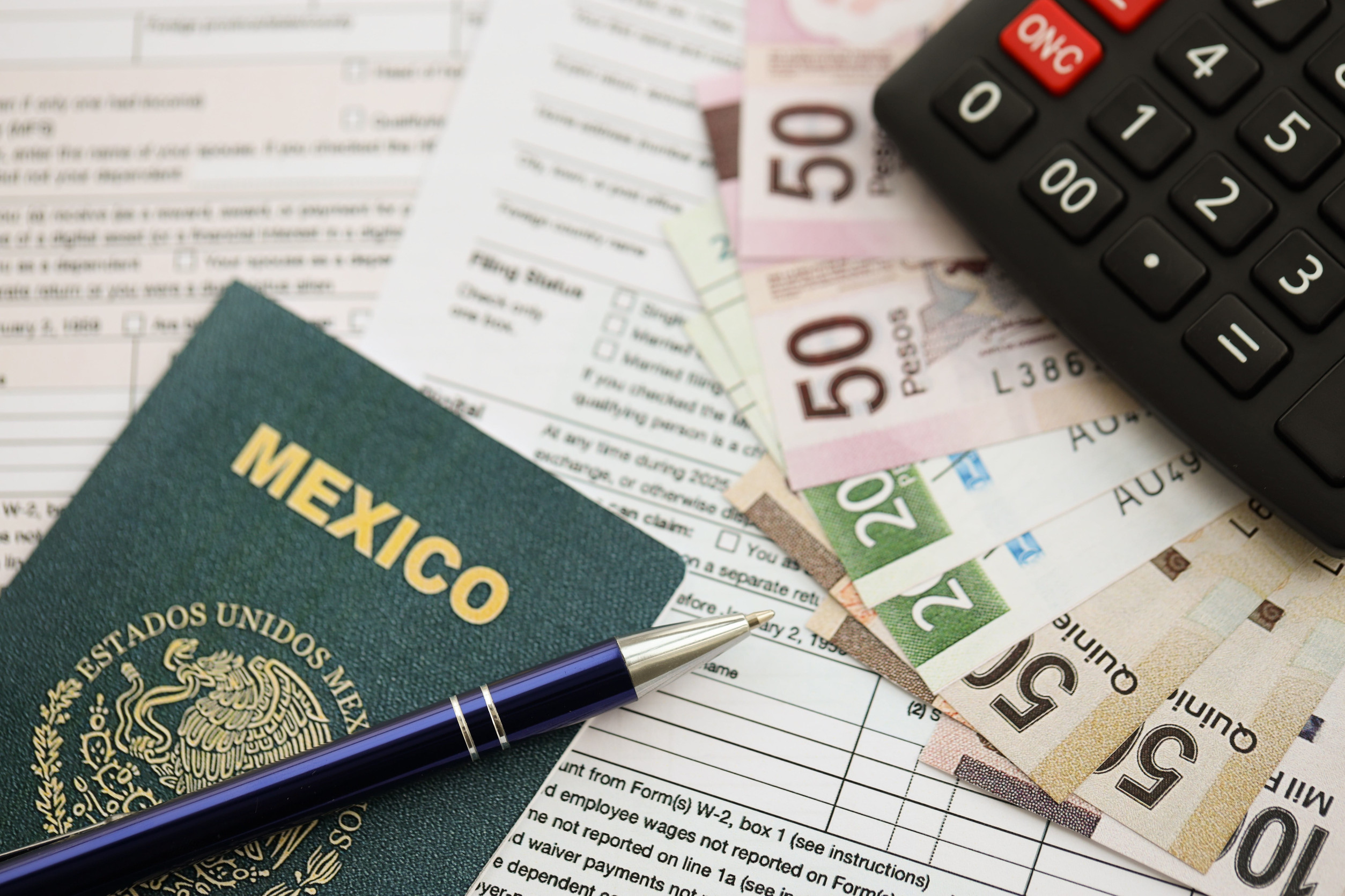 Mexican Pesos, Passport, and Finance Documents