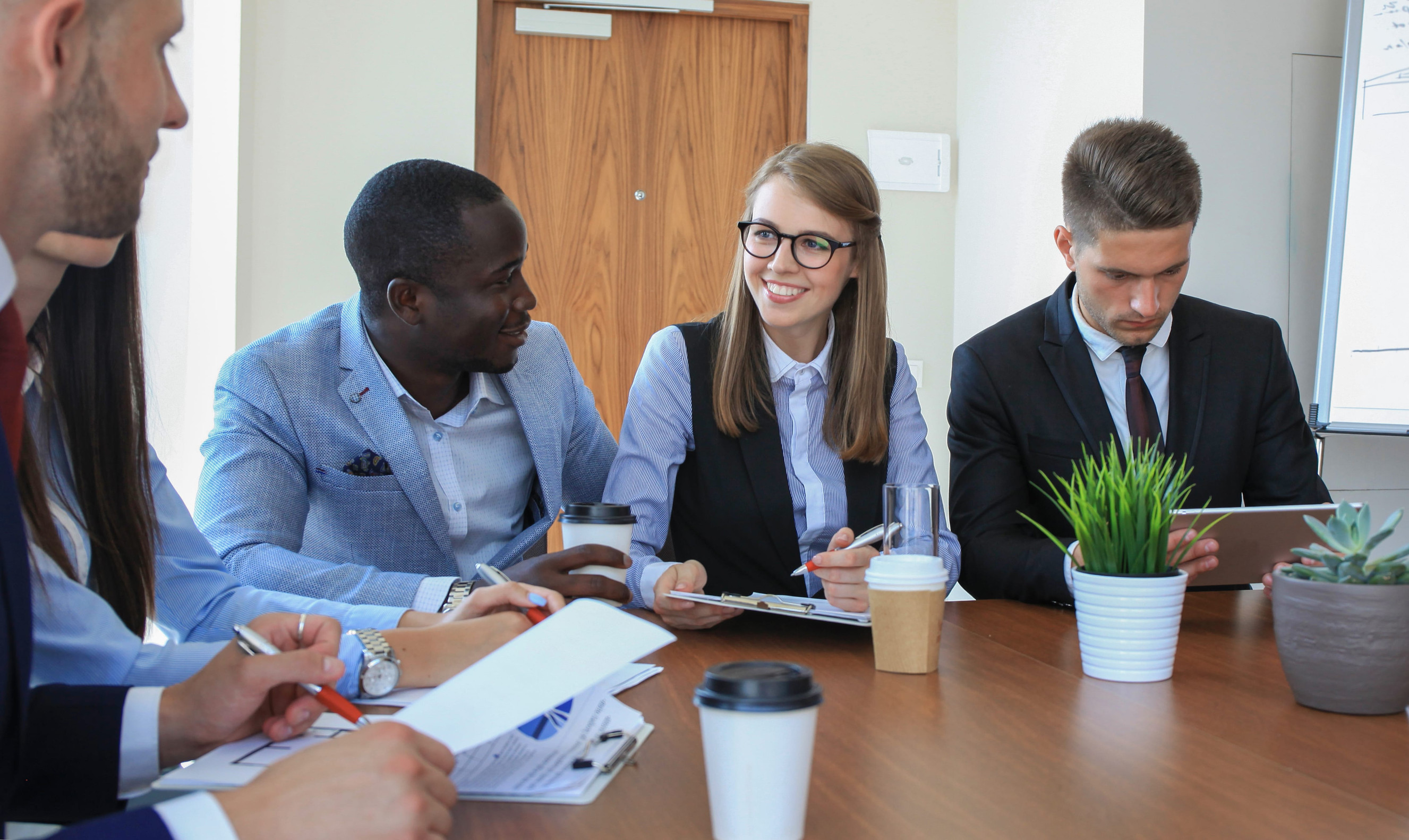 Multiethnic Group Engaged In Business Discussion