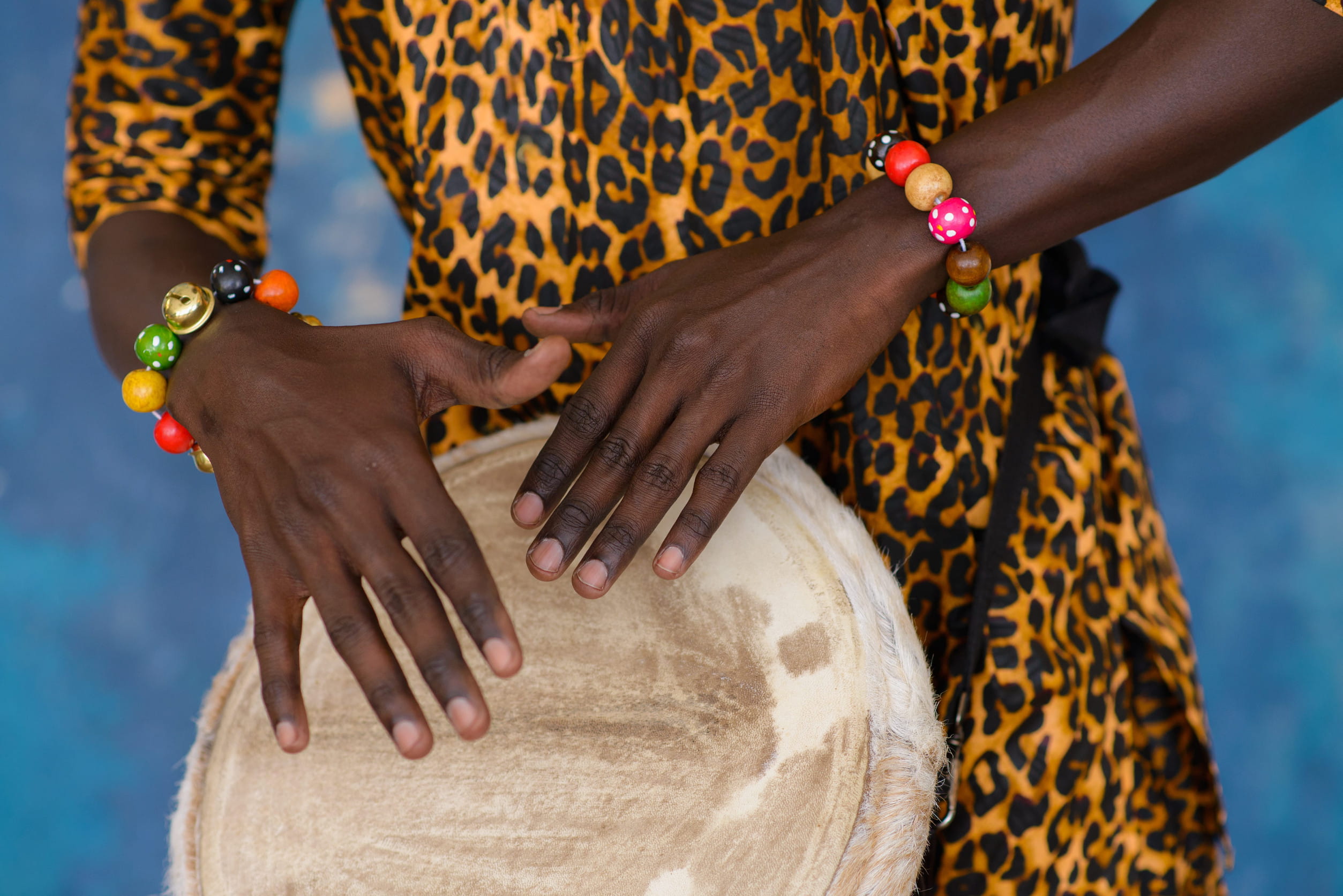 Traditional musicians playing with a handcrafted drum during a cultural performance