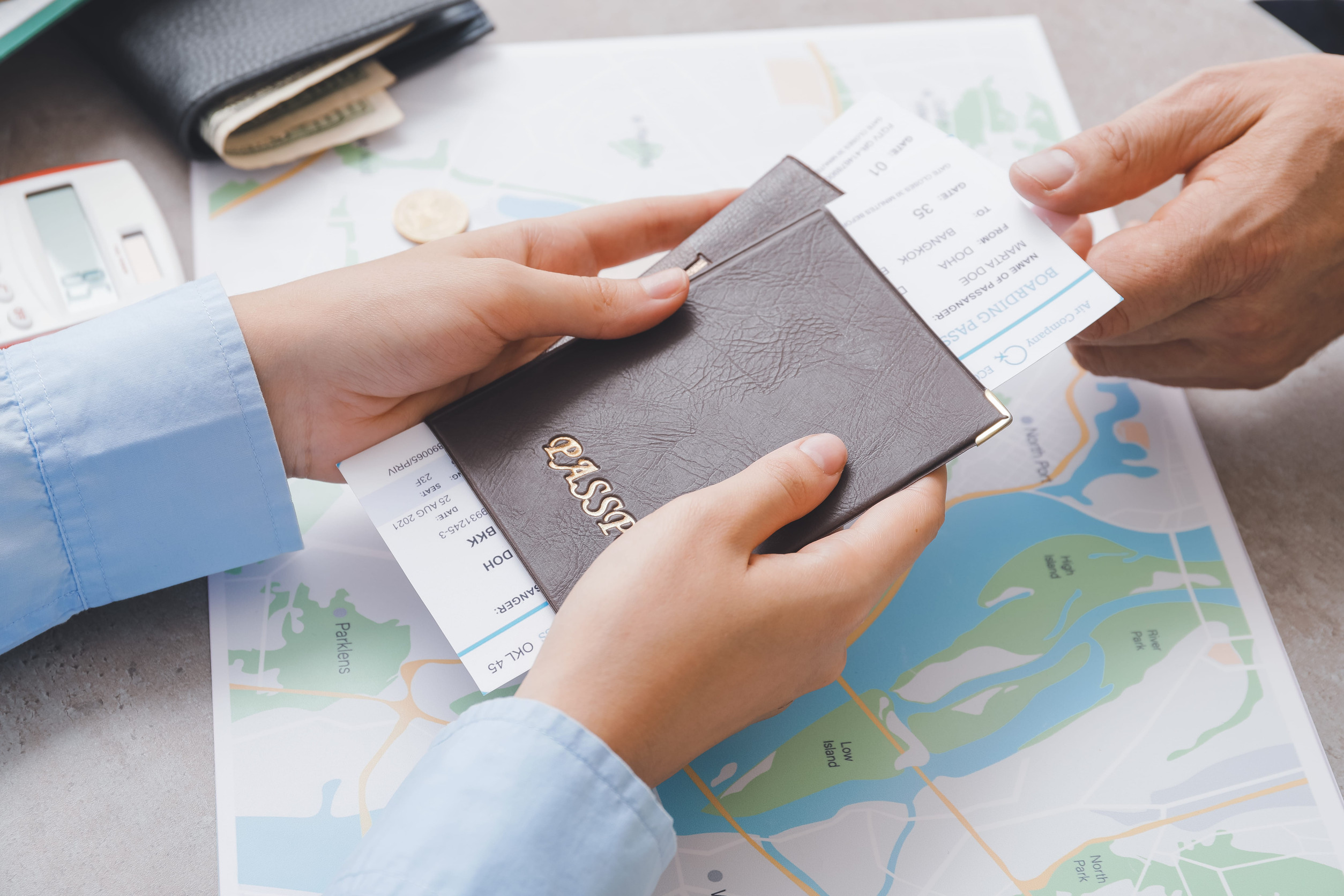 Travel Agent Handing Travel Documents to Client