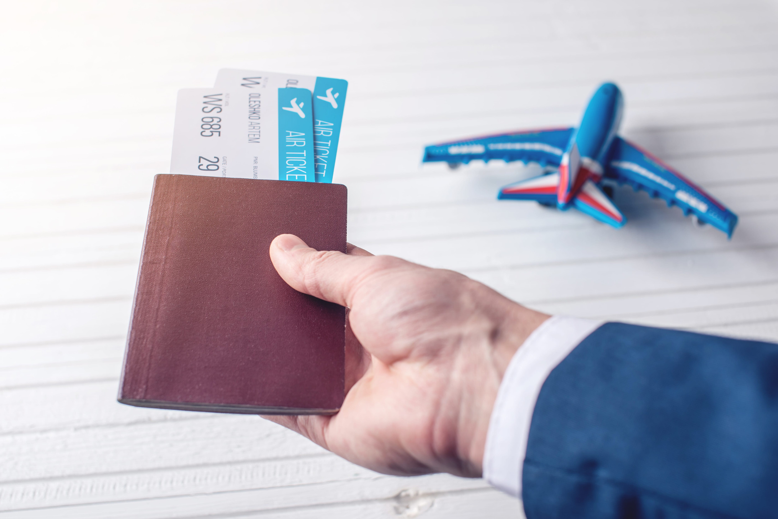 Traveller Holding Passport and Tickets