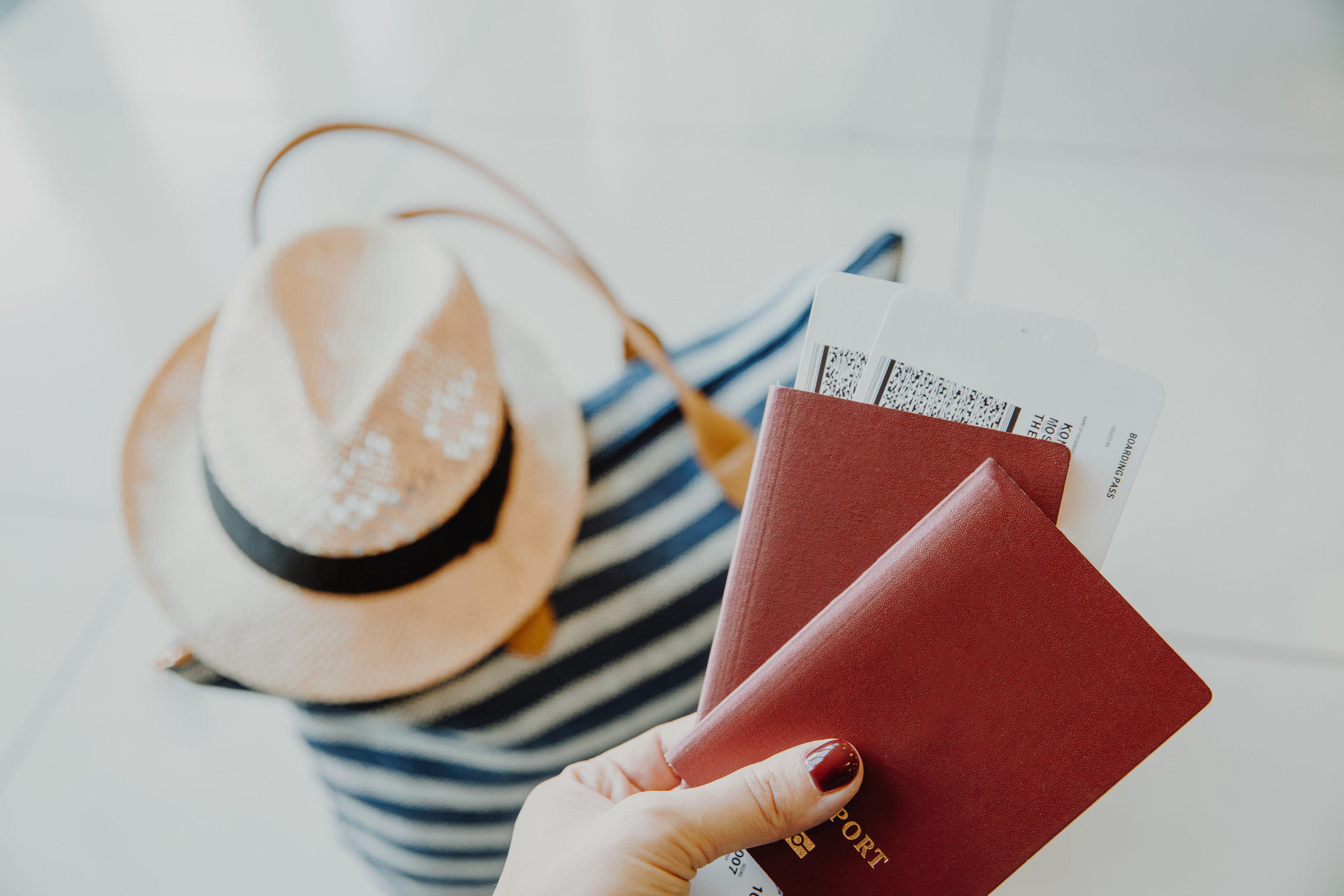 Women passport and boarding pass at airport