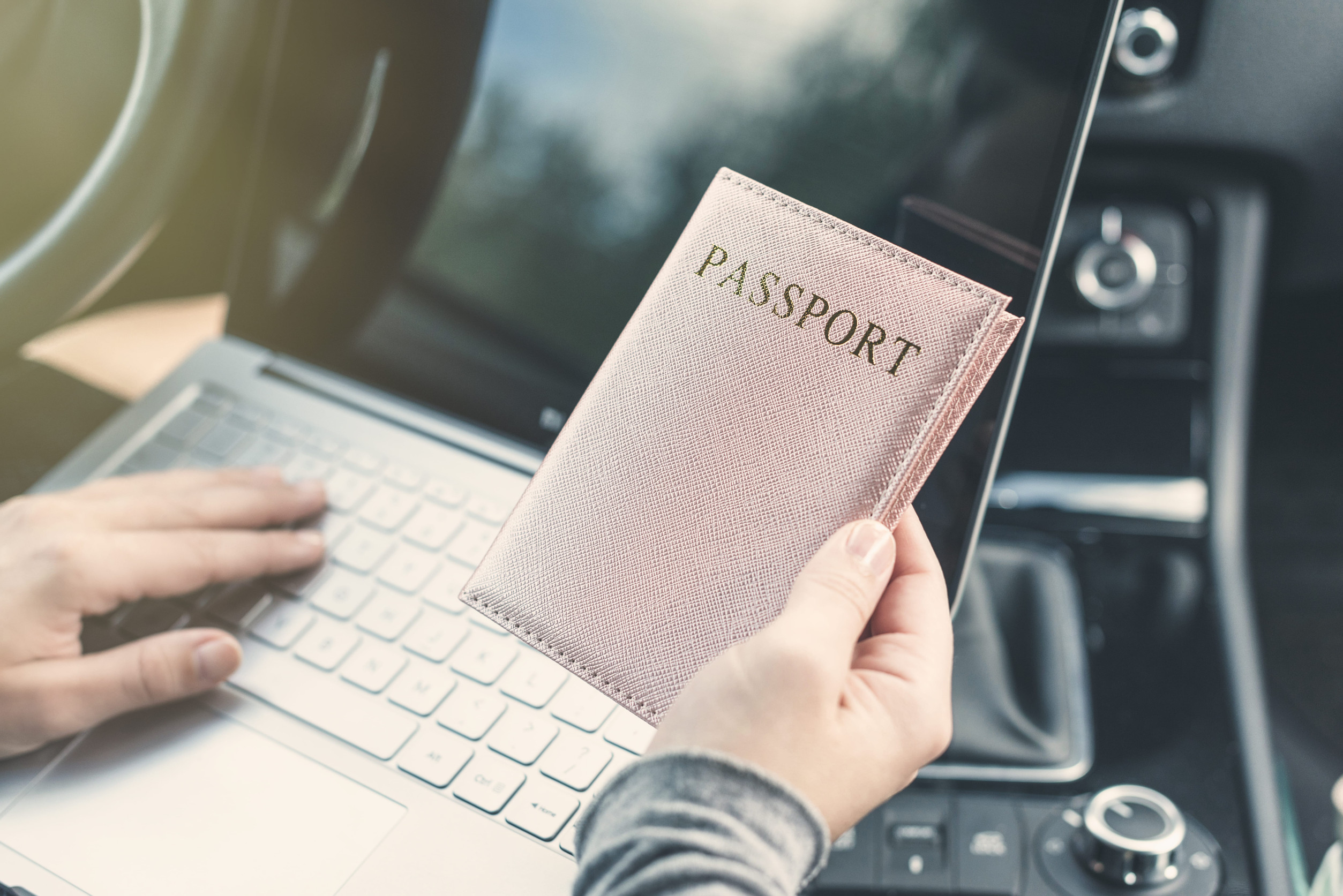 Woman with Laptop and Passport