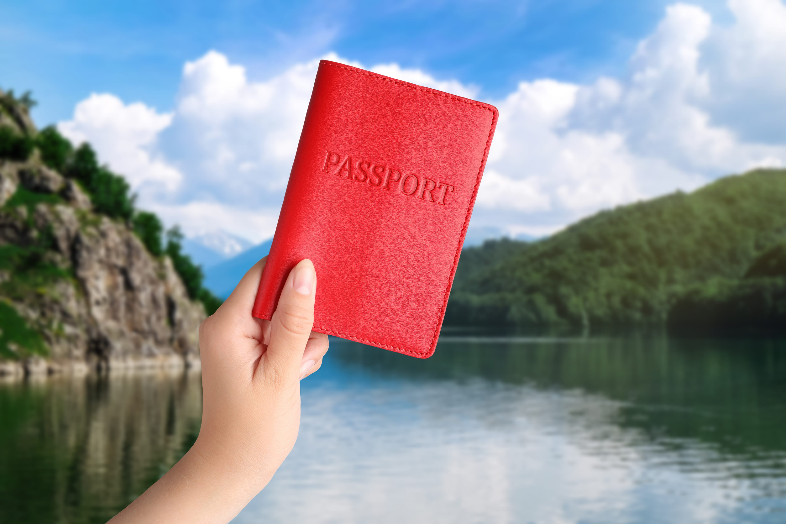 Woman with Passport by Lake